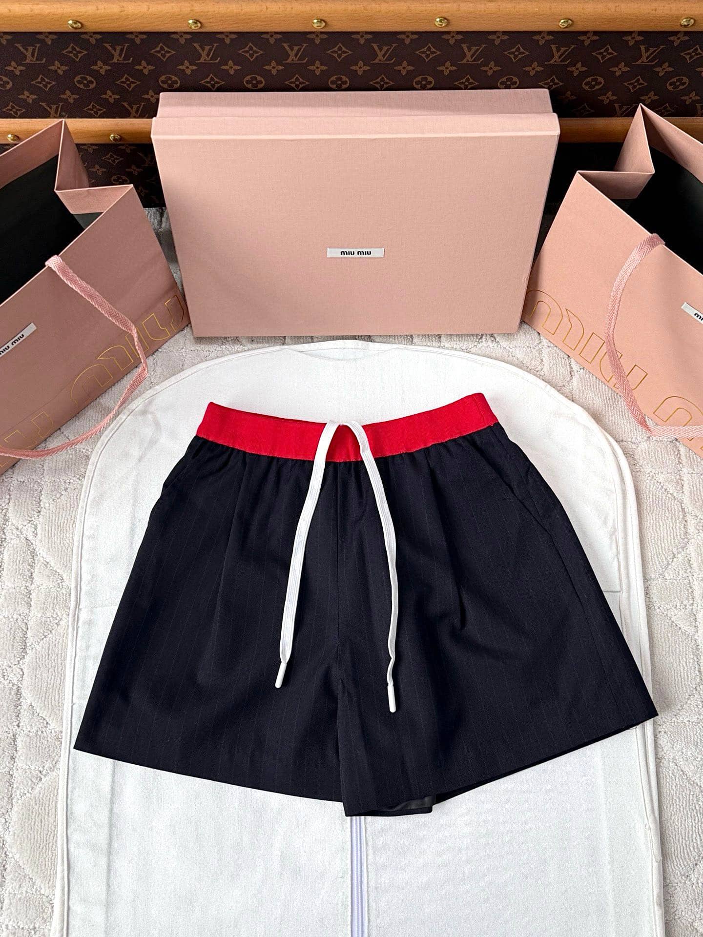 Miu Miu: Shorts, stripes, contrast panels, drawstring, autumn/winter 2025