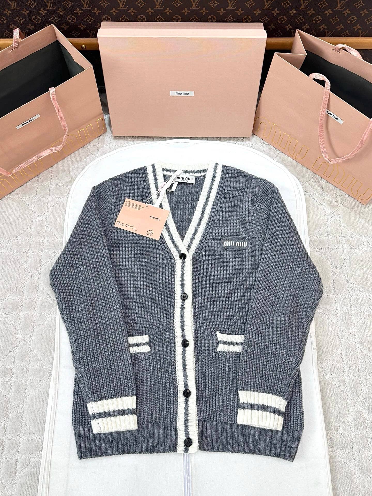 Miu Miu: Cardigan, stripes, contrast panels, spring/summer 2025