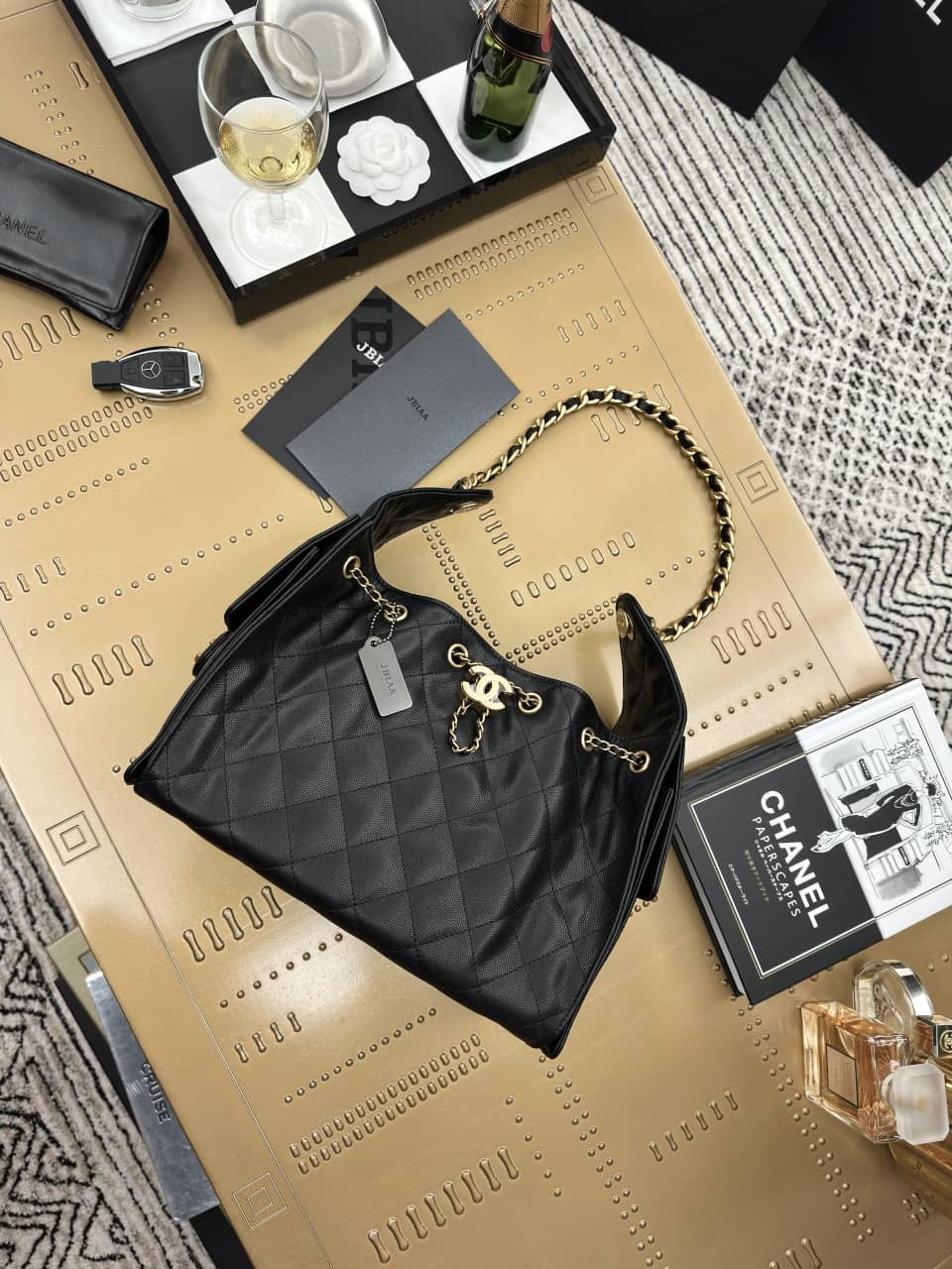Chanel: 25 bag, black with gold-tone hardware, grained calfskin, 30 × 26 × 14 cm
